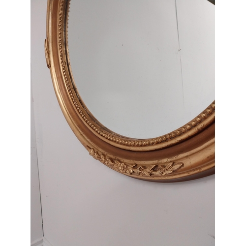 79 - Good quality gilt circular wall mirror with bevelled glass {70 cm H x 60 cm W}.