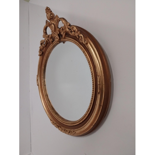 79 - Good quality gilt circular wall mirror with bevelled glass {70 cm H x 60 cm W}.