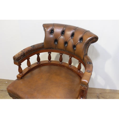 97 - Leather and mahogany Captain's chair {86 cm H x 64 cm W x 56 cm D}.