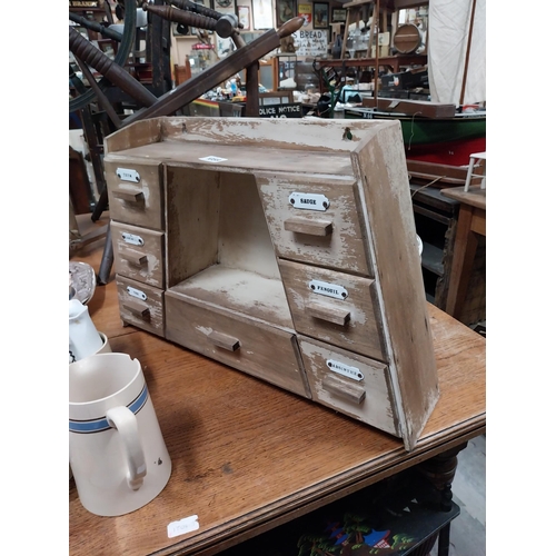 1059 - Early 20th C. painted pine herb drawers in the shape of a triangle  {43 cm H x 67 cm W x 16 cm D}.