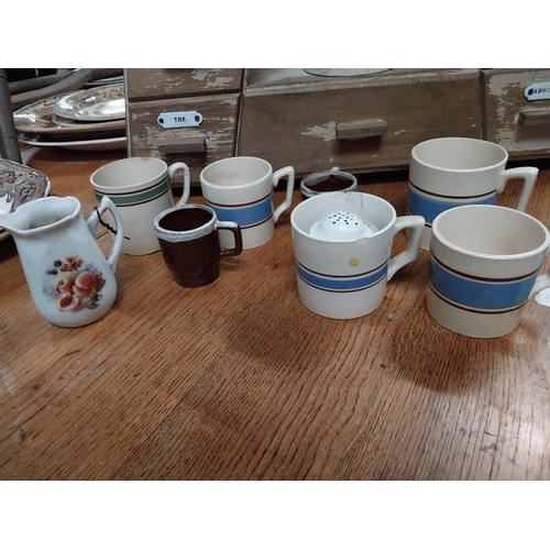 1060 - Collection of nine blue and white Carrigaline Pottery ceramic jugs and mugs made in Ireland.