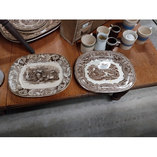 1061 - Two 19th C. brown and white transfer pattern ceramic joint dishes one damaged {35 cm H x 26 cm W}.