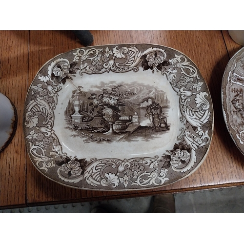 1061 - Two 19th C. brown and white transfer pattern ceramic joint dishes one damaged {35 cm H x 26 cm W}.