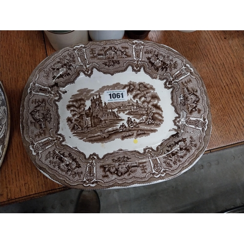 1061 - Two 19th C. brown and white transfer pattern ceramic joint dishes one damaged {35 cm H x 26 cm W}.