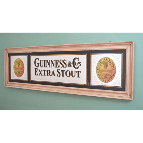 107 - Guinness & Co's Extra Stout framed advertising mirror {53 cm H x 170 cm W}.