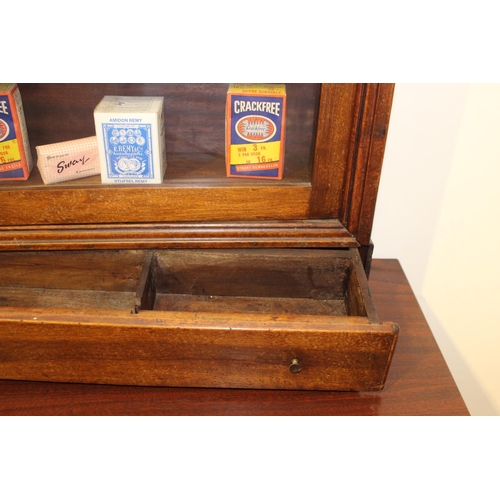 115 - Mahogany display cabinet with single drawer over glazed door. { 94 cm H x 65 cm W x 18 cm D}.