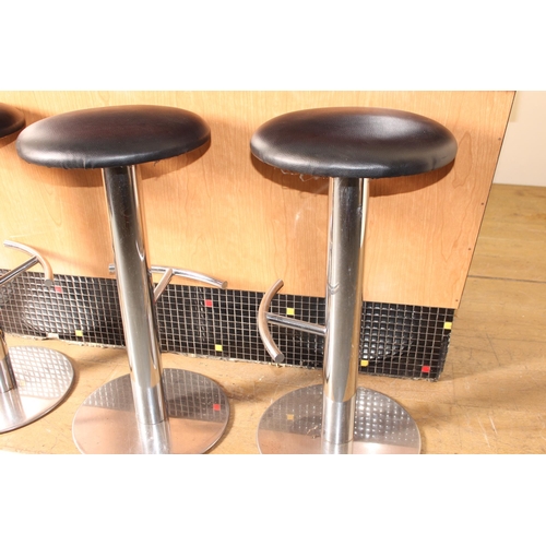 117 - Set of four chrome and leather bar stools with chrome foot rest {75 cm H x 40 cm Dia.}.