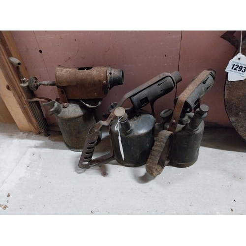 1294 - Three 20th C. brass and metal blow torches. {23 cm H}.