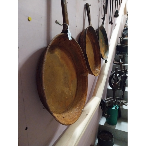 1296 - Three large 20th C. metal frying pans. Largest {70 cm H x 14 cm W}