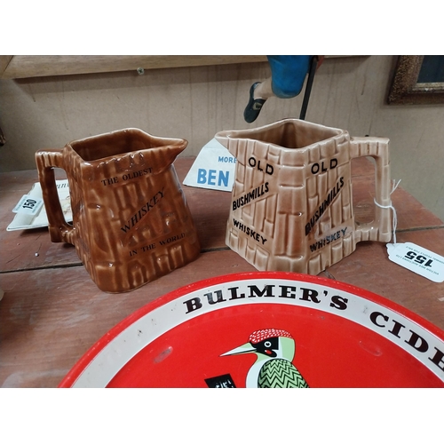 155 - Two Old Bushmills whiskey Arklow pottery ceramic advertising jugs {10cm H x 15cm W x 9cm D}