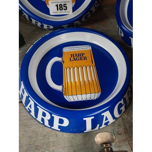 185 - Set of three Harp lager tinplate advertising ashtrays {4cm H x 21cm Dia.}.