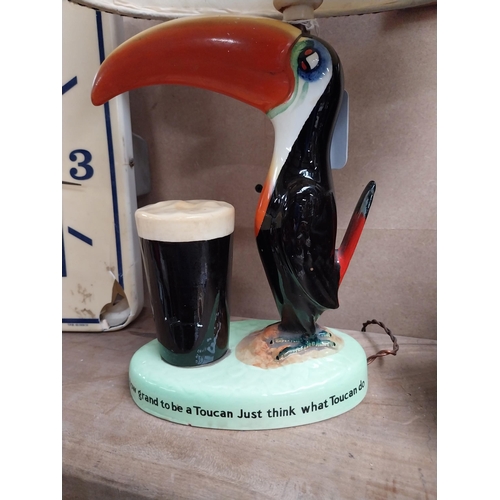 212 - Guinness Toucan ceramic advertising lamp with original shade {43 cm H x 32 cm W x 20 cm D}.