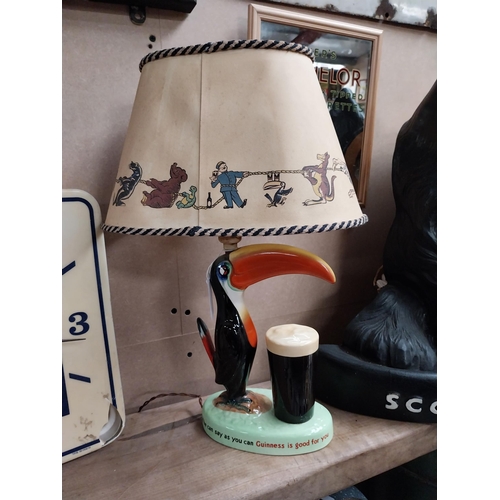 212 - Guinness Toucan ceramic advertising lamp with original shade {43 cm H x 32 cm W x 20 cm D}.