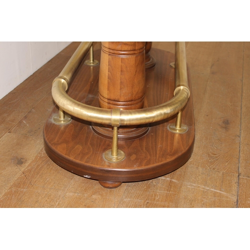 214 - Oak oval drinks stand with brass hand rail and brass foot rest. { 106 cm H x 178 cm W x 108 cm D}.