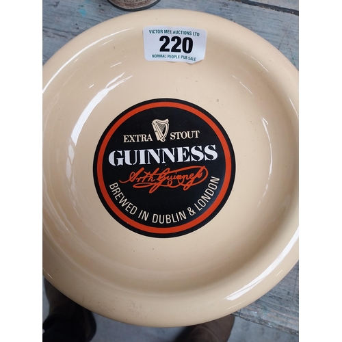 220 - Extra Stout Guinness ceramic advertising ashtray in the form of a bottle top {22 cm Dia.}.