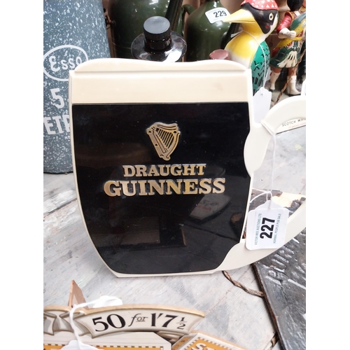 227 - Draught Guinness Perspex counter sign. {20 cm H x 23 cm W}.