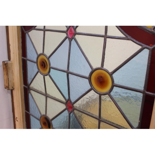 232 - Stain glass bar divider with bull's eye design. { 210 cm H x 64 cm W x 4 cm D}.