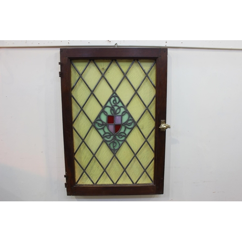 241 - Stain glass leaded window with brass handle. { 89 cm H x 59 cm W x 5 cm D}.