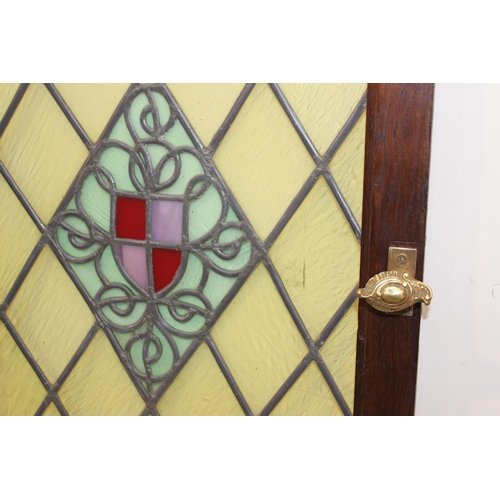 241 - Stain glass leaded window with brass handle. { 89 cm H x 59 cm W x 5 cm D}.