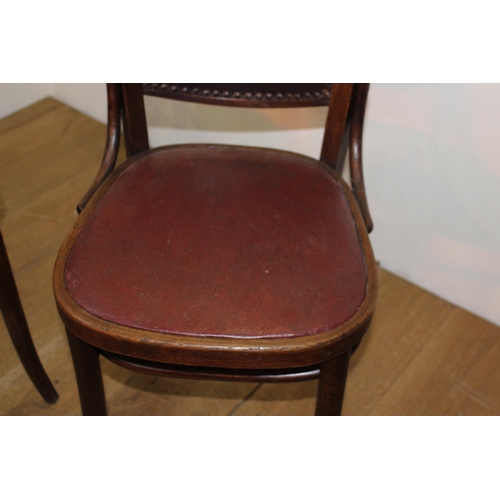 277 - Set of four bentwood chairs with leather seat and back. {90 cm H x 40 cm W x 40 cm D}.