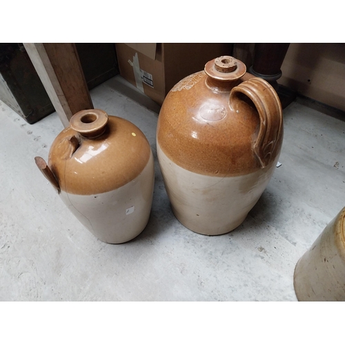 284 - Two stoneware flagons - E J O Coope Tubbercurry and another unnamed. {40 cm H x 23 cm Diam and 30 cm... 