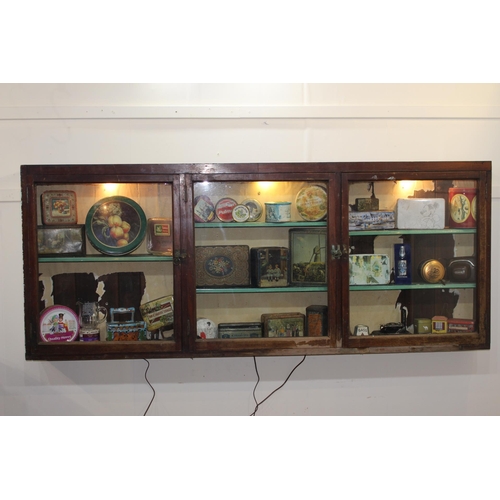 295 - 19th C. mahogany display cabinet with three glazed doors. { 80 cm H x 196 cm W x 15 cm D}.