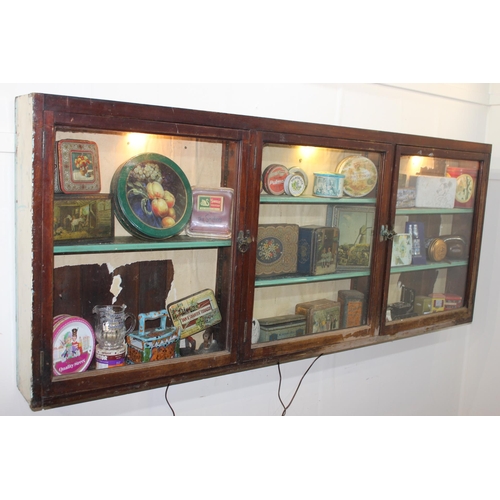 295 - 19th C. mahogany display cabinet with three glazed doors. { 80 cm H x 196 cm W x 15 cm D}.