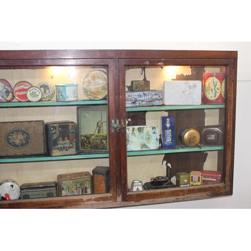 295 - 19th C. mahogany display cabinet with three glazed doors. { 80 cm H x 196 cm W x 15 cm D}.