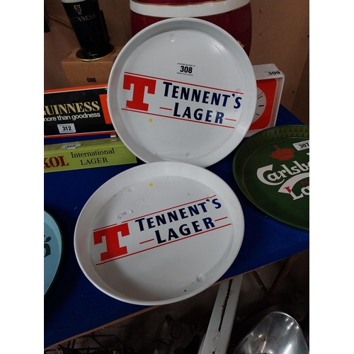 308 - Two Tennent's Lager tinplate advertising drinks trays. {30 cm Diam}.