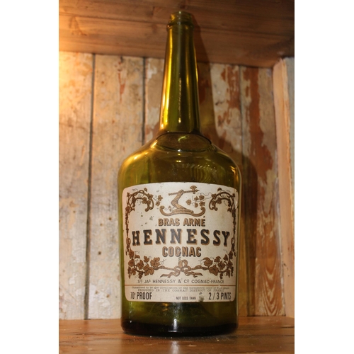 313 - Bras Arm� Hennessy Cognac - not less than 2/3 pints bottle. {46 cm H x 15 cm Diam}.