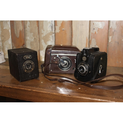 331 - Three box cameras. {16 cm H x 11 cm W x 9  cm D}.