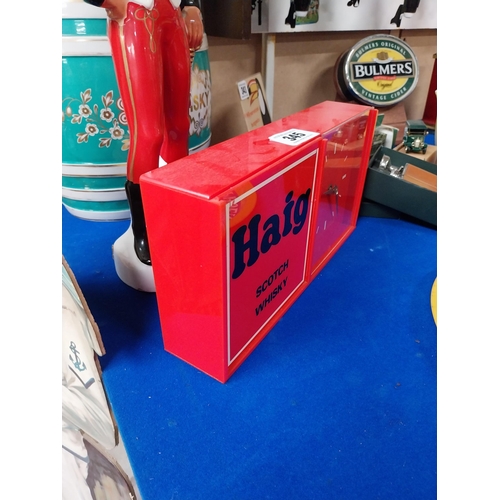 345 - 1950's Haig Whisky advertising clock. {16 cm H x 31 cm W x 6 cm D}.