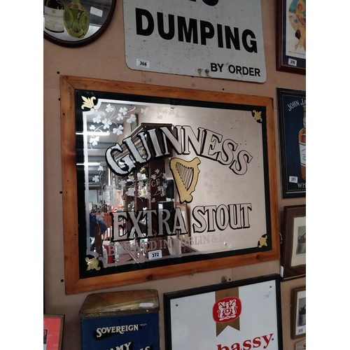 372 - Guinness Extra Stout brewed in Dublin and London framed advertising mirror. {68 cm H x 84 cm W}.