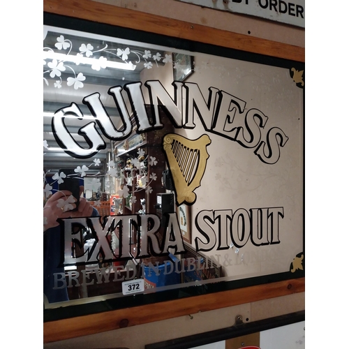 372 - Guinness Extra Stout brewed in Dublin and London framed advertising mirror. {68 cm H x 84 cm W}.