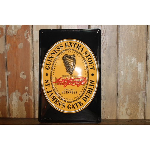 385 - Guinness Extra Stout metal advertising sign. { 30 cm H x 20 cm W}.