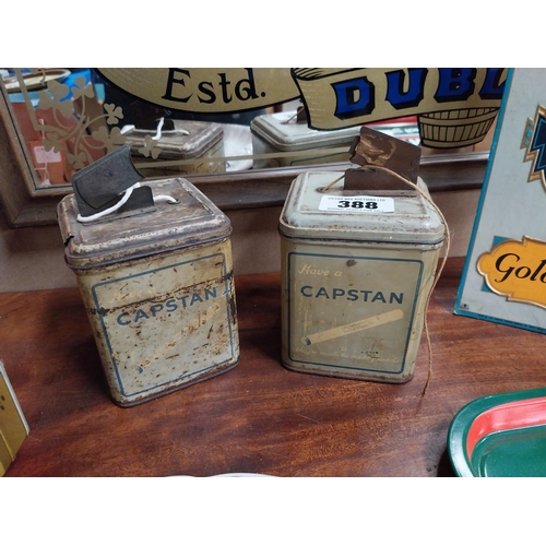 388 - Pair of Capstan advertising string tins. {17 cm H x 10 cm W x 10 cm D}.