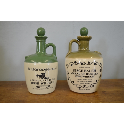 395 - Tullamore dew bottle and another whiskey jar {20 cm H x 12 cm W}.