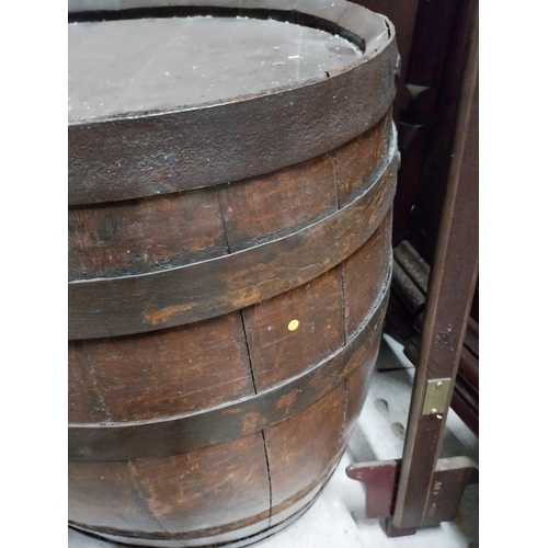 398 - Early 20th C. oak metal bound whiskey barrel. {61 cm H x 50 cm W x 40 cm D}.