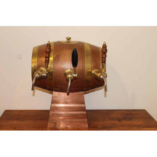 412 - Three optic set in from of copper and brass barrel. { 48 cm H x 40 cm W x 40 cm D}.