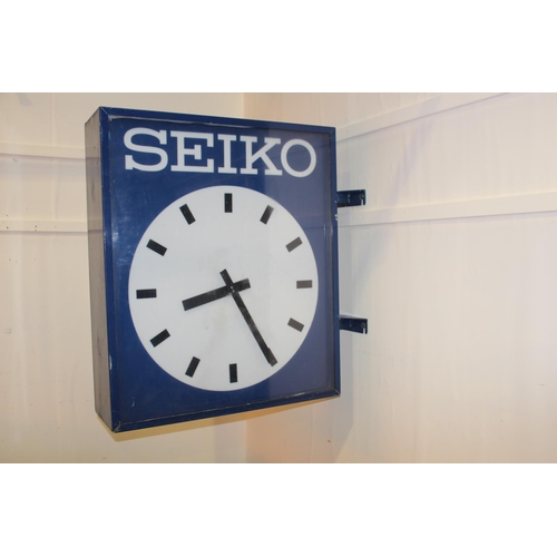 421 - Seiko double sided advertising clock. { 100 cm H x 27 cm W x 100 cm D}.