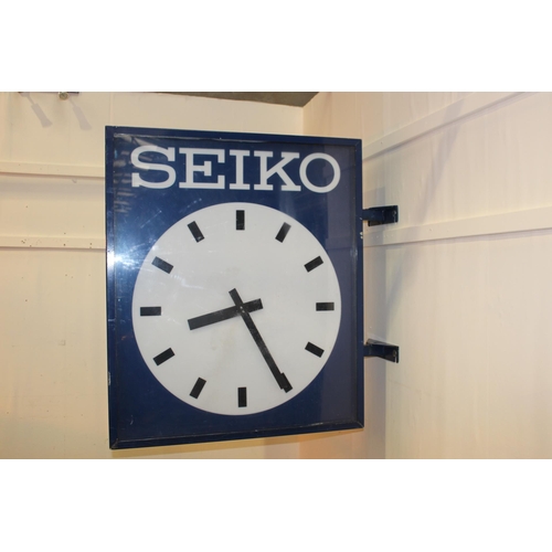 421 - Seiko double sided advertising clock. { 100 cm H x 27 cm W x 100 cm D}.