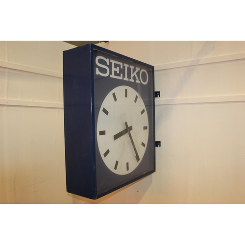 421 - Seiko double sided advertising clock. { 100 cm H x 27 cm W x 100 cm D}.