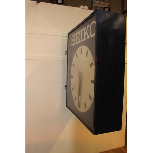 421 - Seiko double sided advertising clock. { 100 cm H x 27 cm W x 100 cm D}.