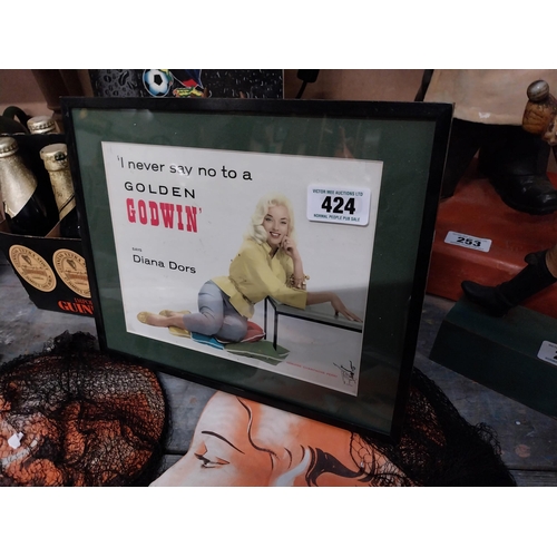 424 - I Never Say No to a Golden Godwin says Diana Dors framed advertising showcard.