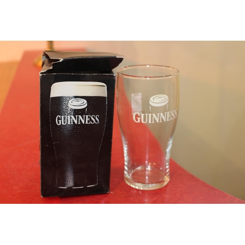 81 - Set of three Guinness advertising pint glasses in original box {15 cm H x 5 cm Dia.}.