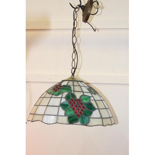 995 - Brass and leaded stained glass handing light in the Tiffany style {60 cm H x 40 cm Dia.}.