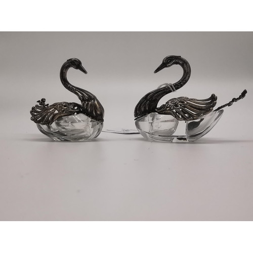 156A - Decorative pair of lead crystal and sterling silver salts in the form of swans with movable wings an... 