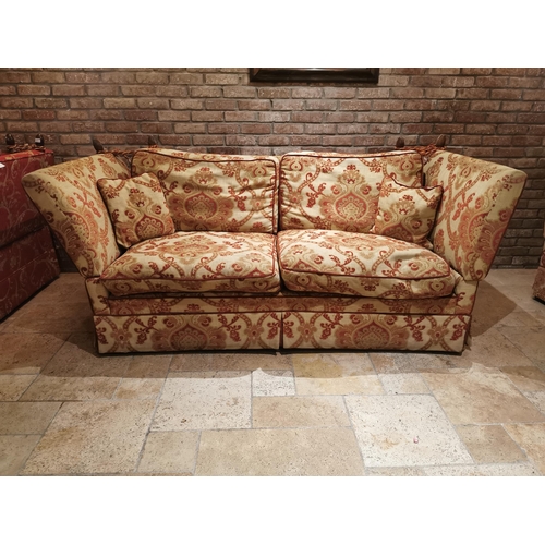 100 - Decorative cream and red upholstered two seater couch with cushions, with drop down sides  in the Du... 