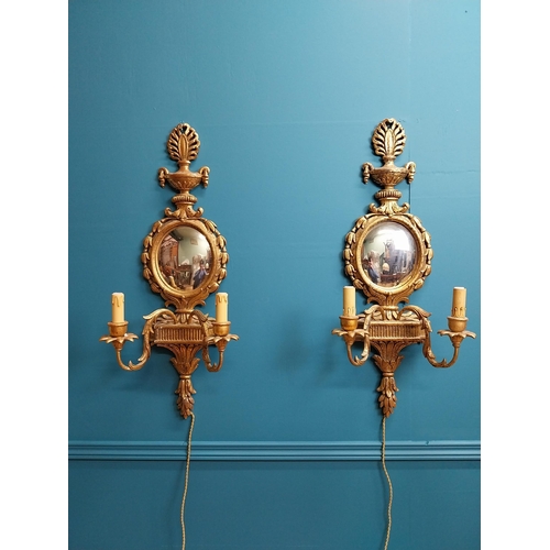 111 - Pair of exceptional quality giltwood mirrored two branch wall sconces in the Adams manner {76 cm H x... 