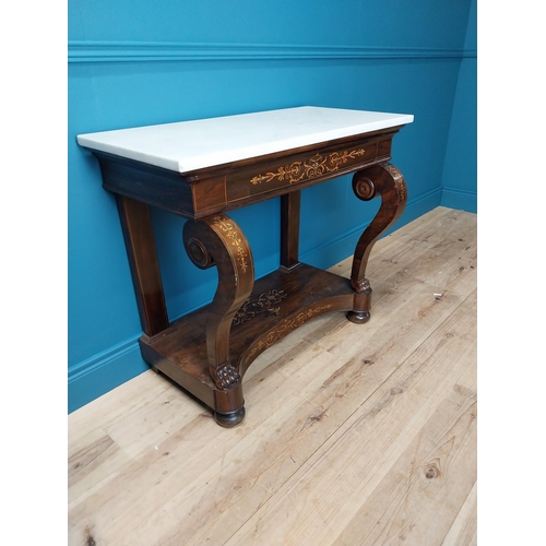 121 - William IV rosewood and satinwood inlaid consul table with marble top and single drawer in the friez... 